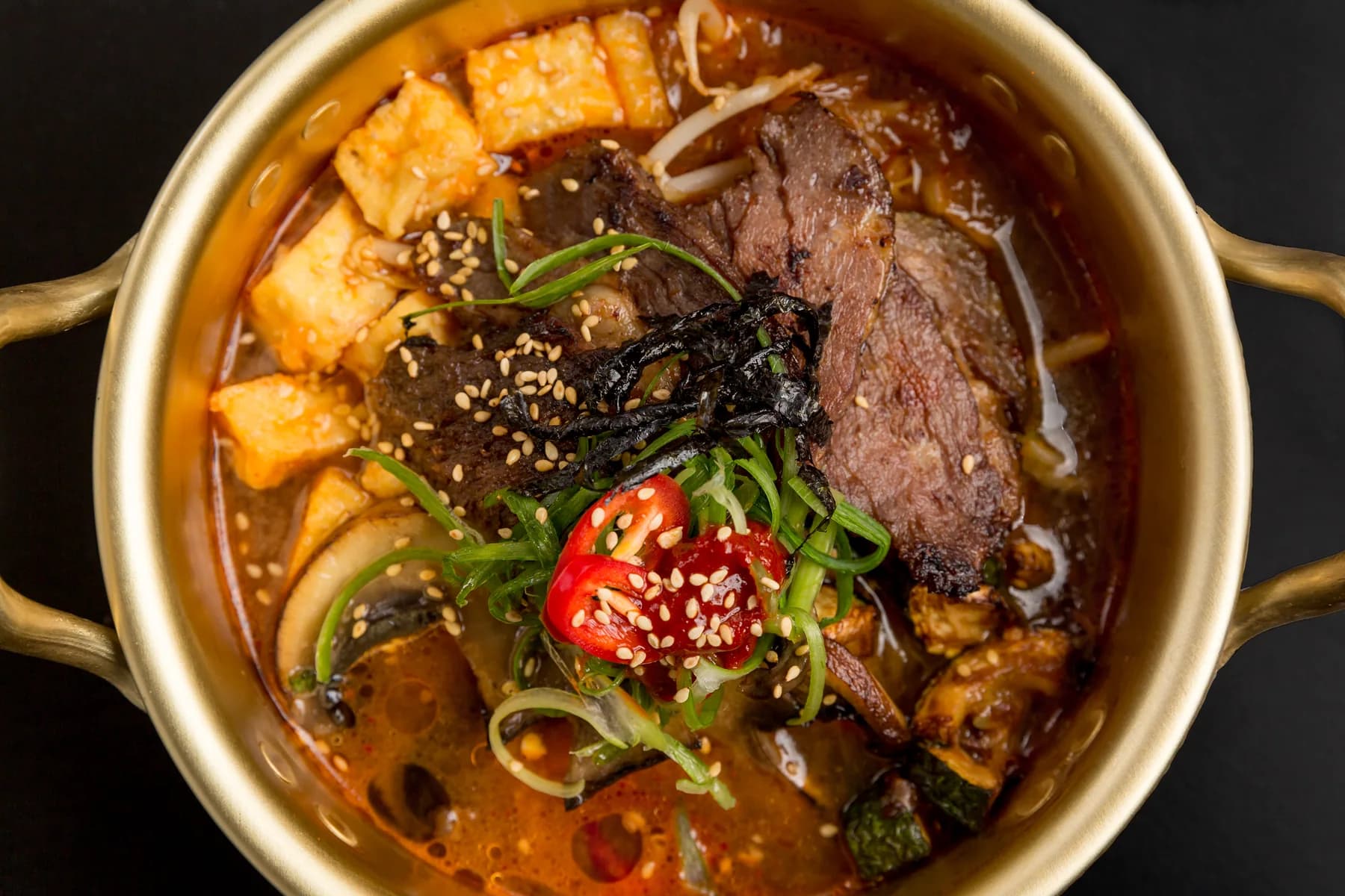 Korean braised beef served in a brass pot