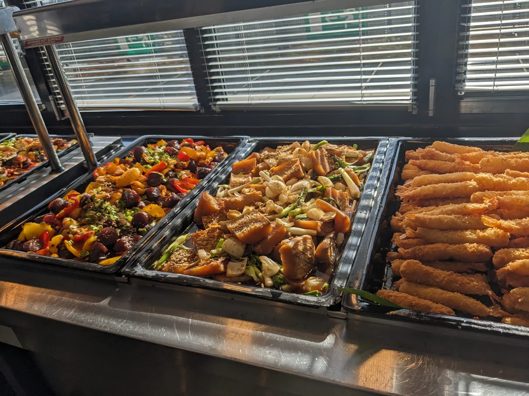 High-volume Korean buffet with several finished hot dishes