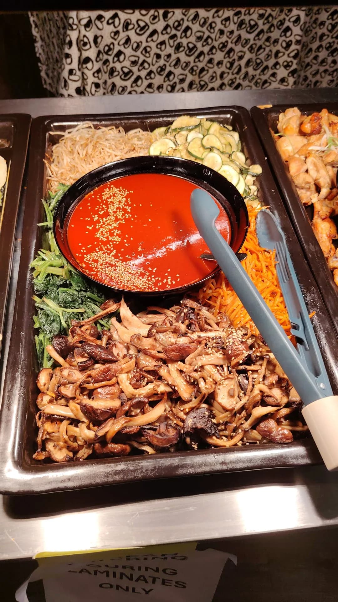 Korean vegetables and mushrooms arranged for buffet service